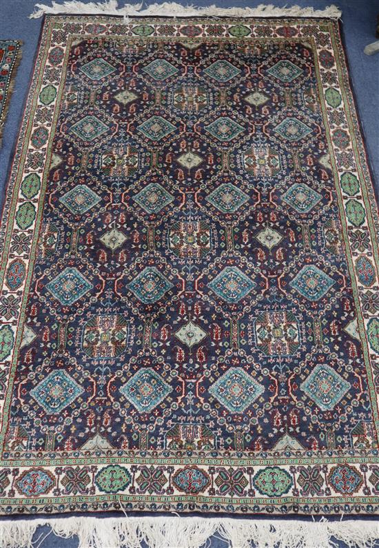 A Persian blue ground rug, 180 x 120cm.